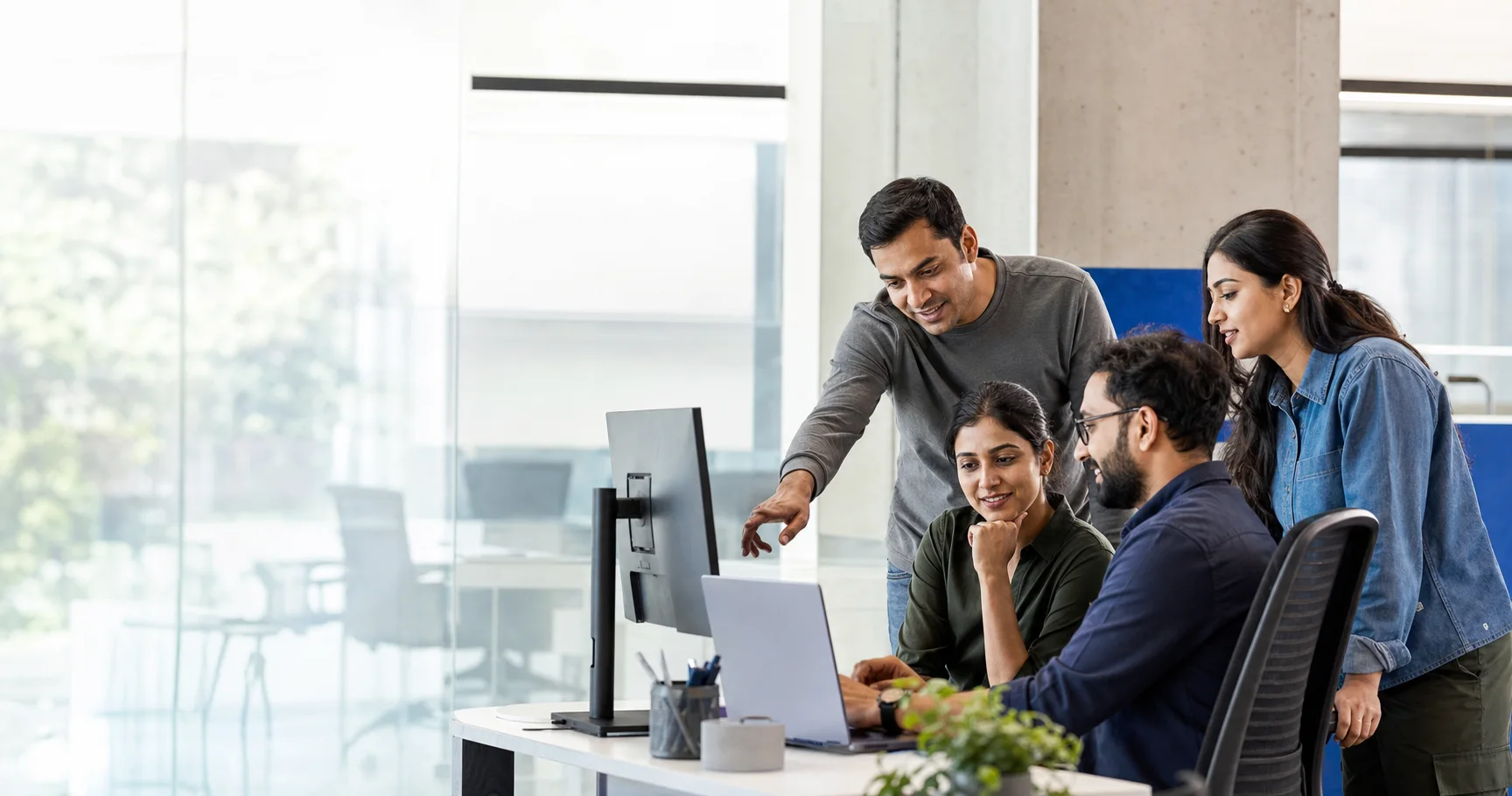 A collaborative product engineering team reviewing software